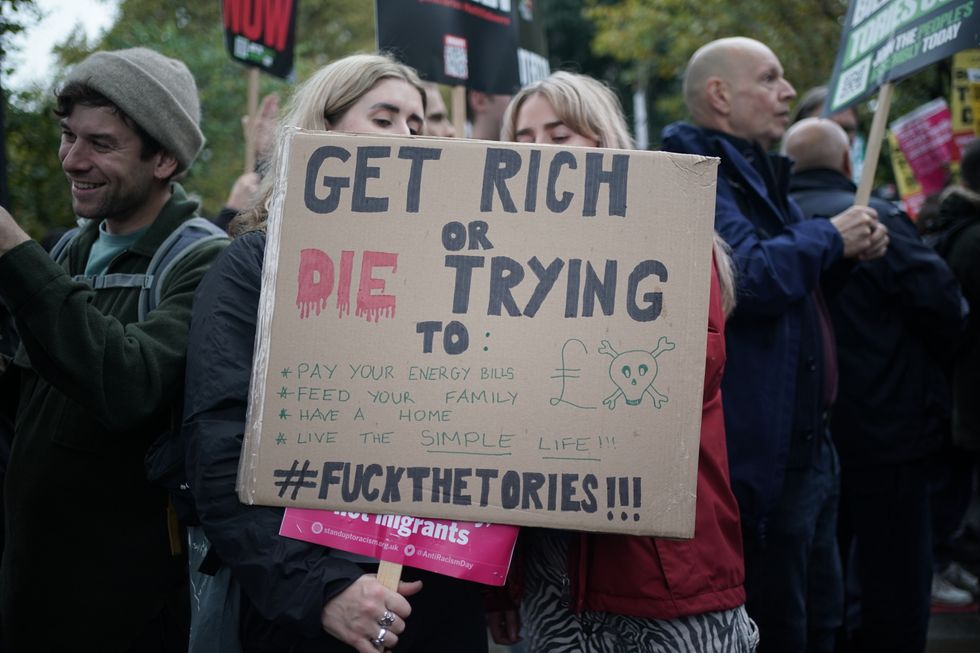 NOTE LANGUAGE ON PLACARDS People take part in the People's Assembly Britain is Broken national demonstration in central London. Picture date: Saturday November 5, 2022.