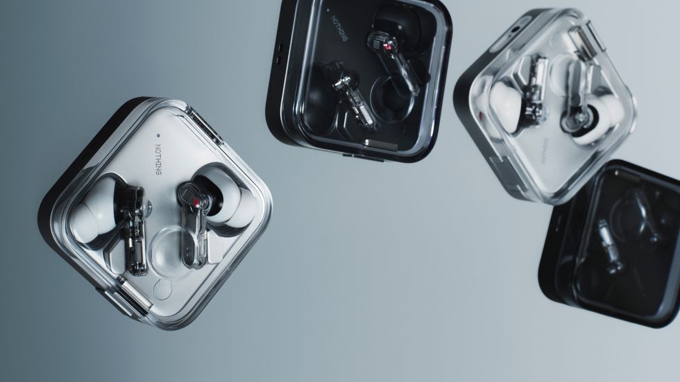 Nothing Ear (3) charging case in White and Black pictured in the air