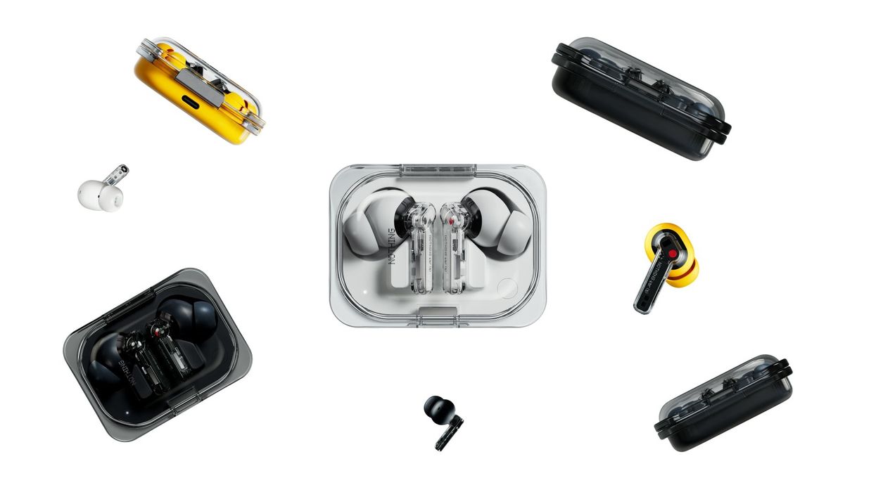nothing ear a earbuds in the charging case and with earbuds in the air on a white background