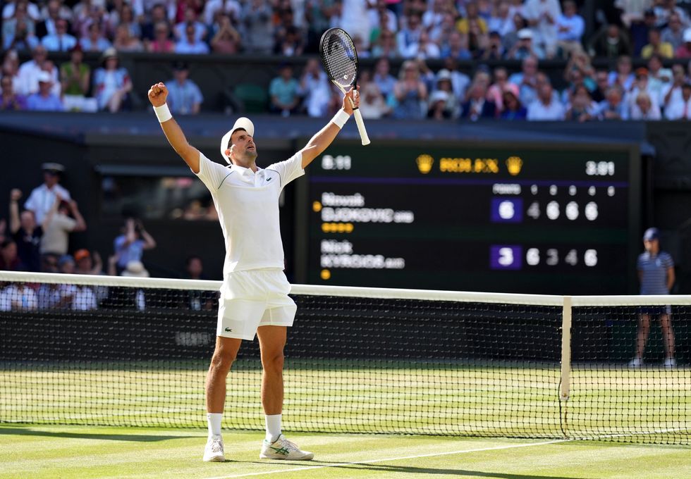 Novak Djokovic celebrates victory over Nick Kyrgios in The Final of the Gentlemen's Singles on day fourteen of the 2022 Wimbledon Championships at the All England Lawn Tennis and Croquet Club, Wimbledon.