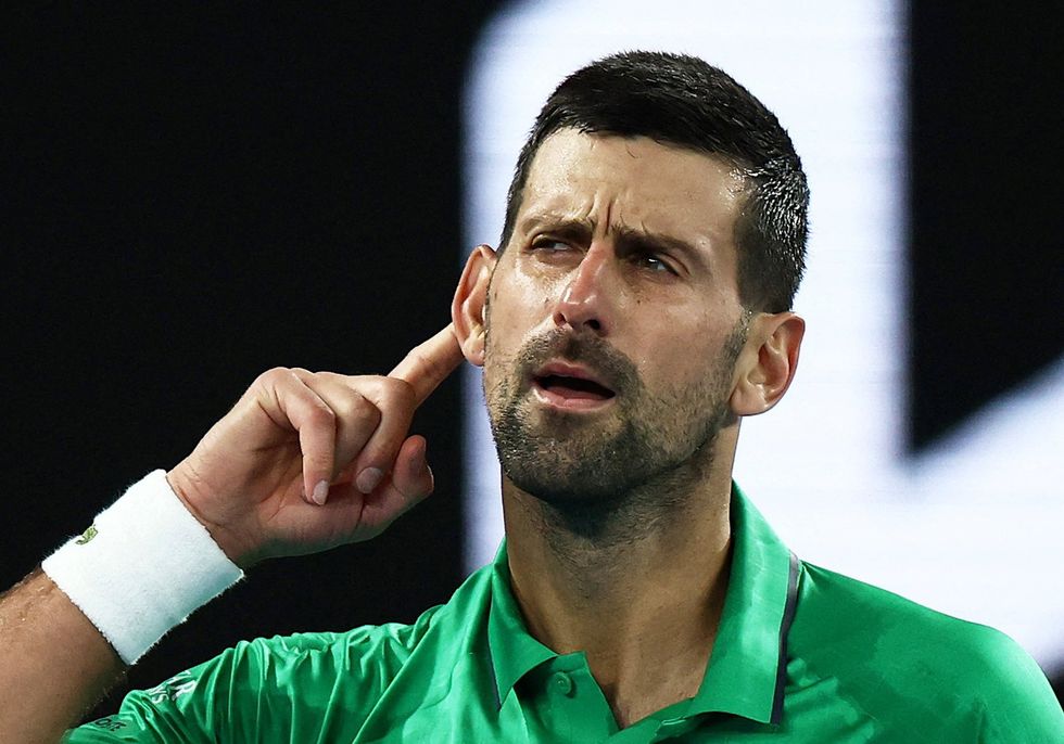 Novak Djokovic is through to the next round of the Australian Open without hitting a ball