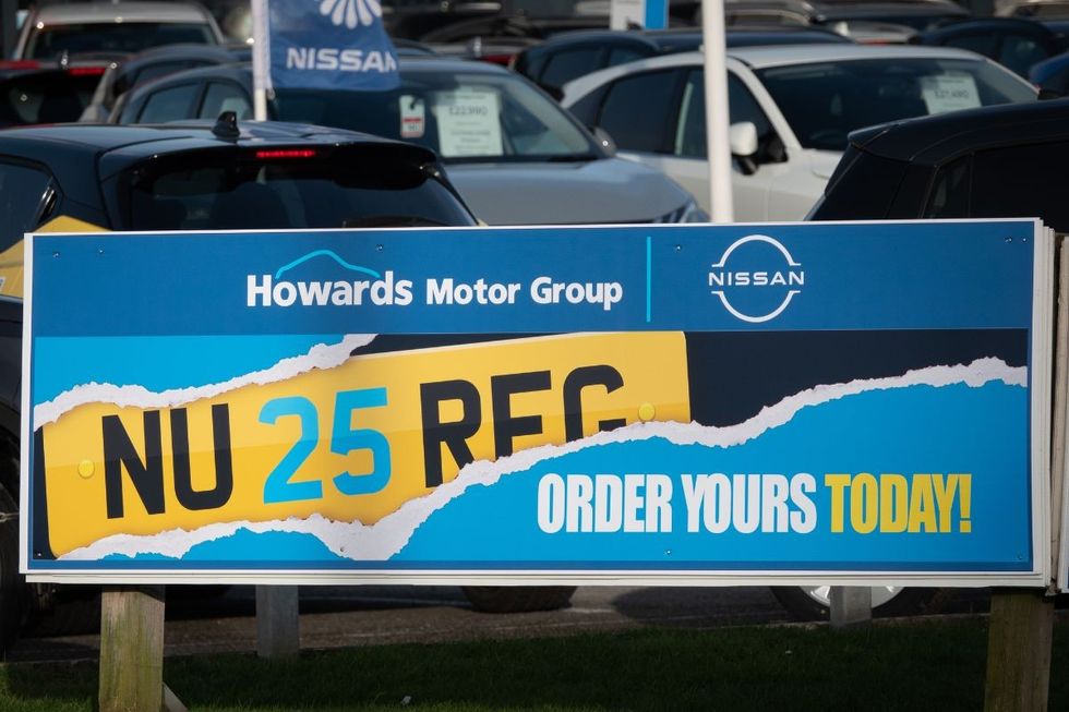 Number plate advert at car sales forecourt