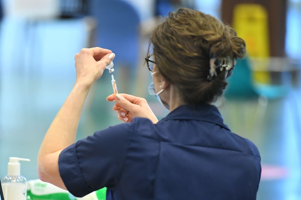 Nurse preparing to give vaccine