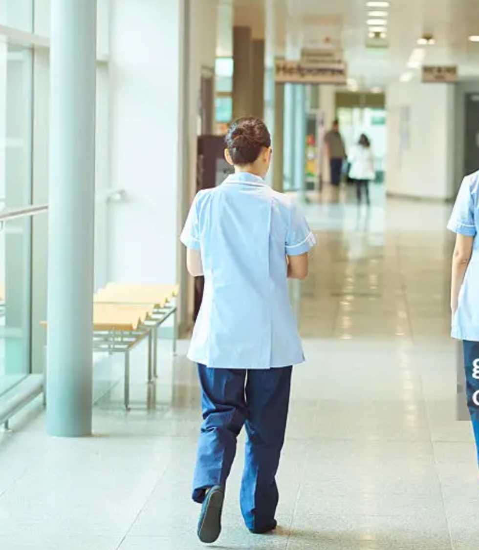 Nurse walking through hospital