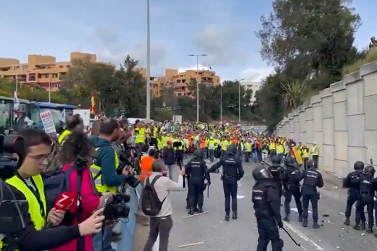 Objects were hurled at riot police in the Spanish port