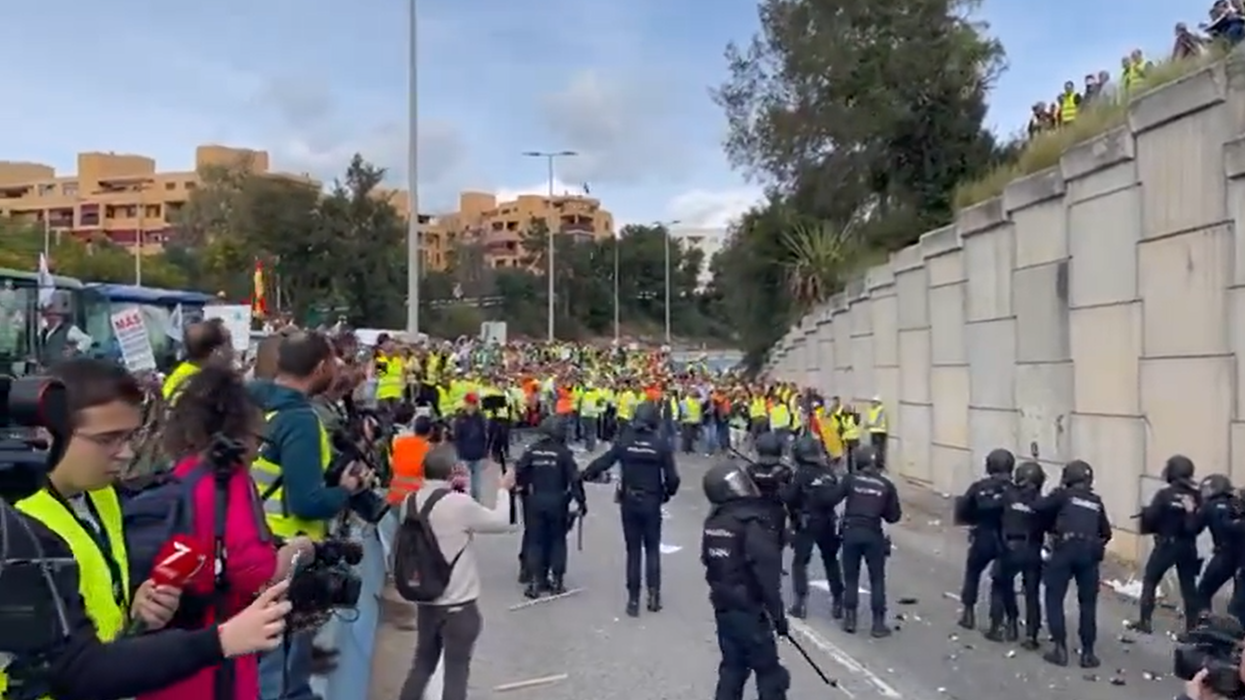 Objects were hurled at riot police in the Spanish port