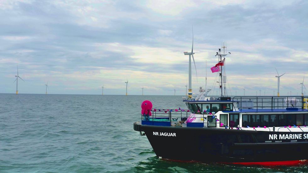 Octopus Energy merchandise on boat by offshore wind turbine farm