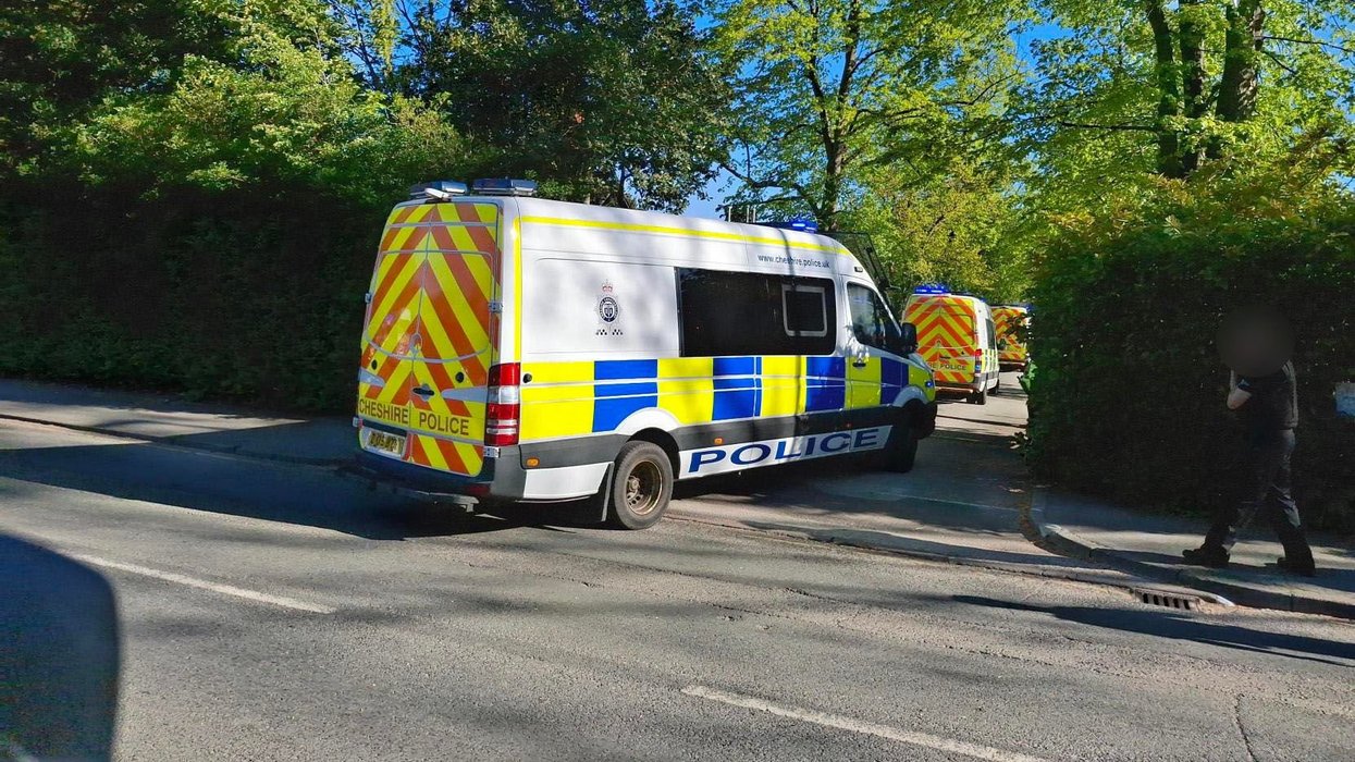 Officers attending a property in Crewe