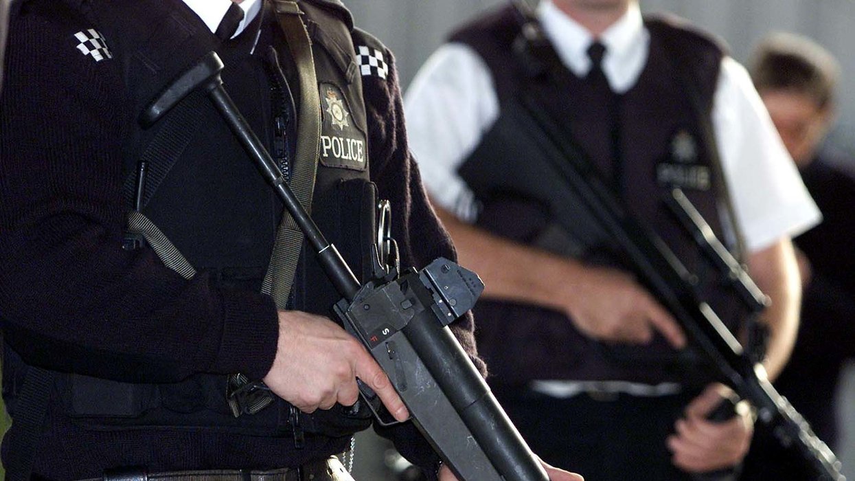 Officers holding guns