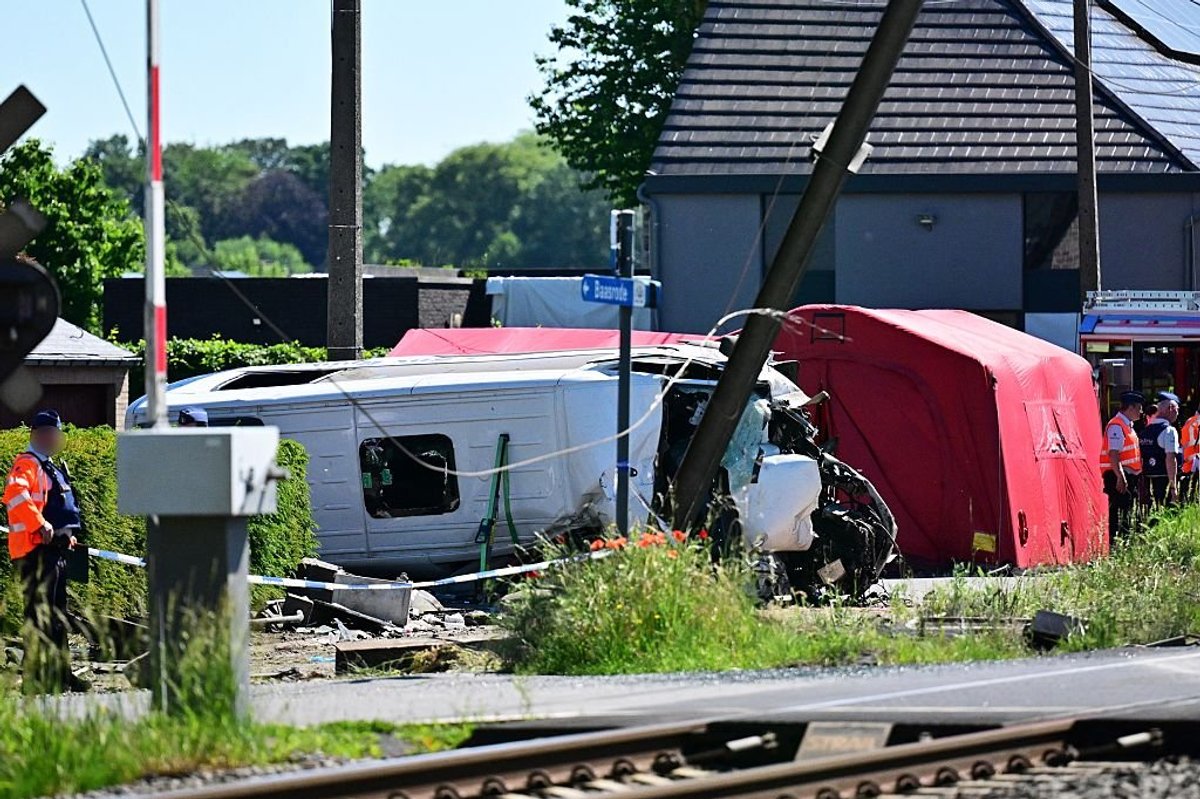 Multiple fatalities after school bus struck by passenger train in Belgium