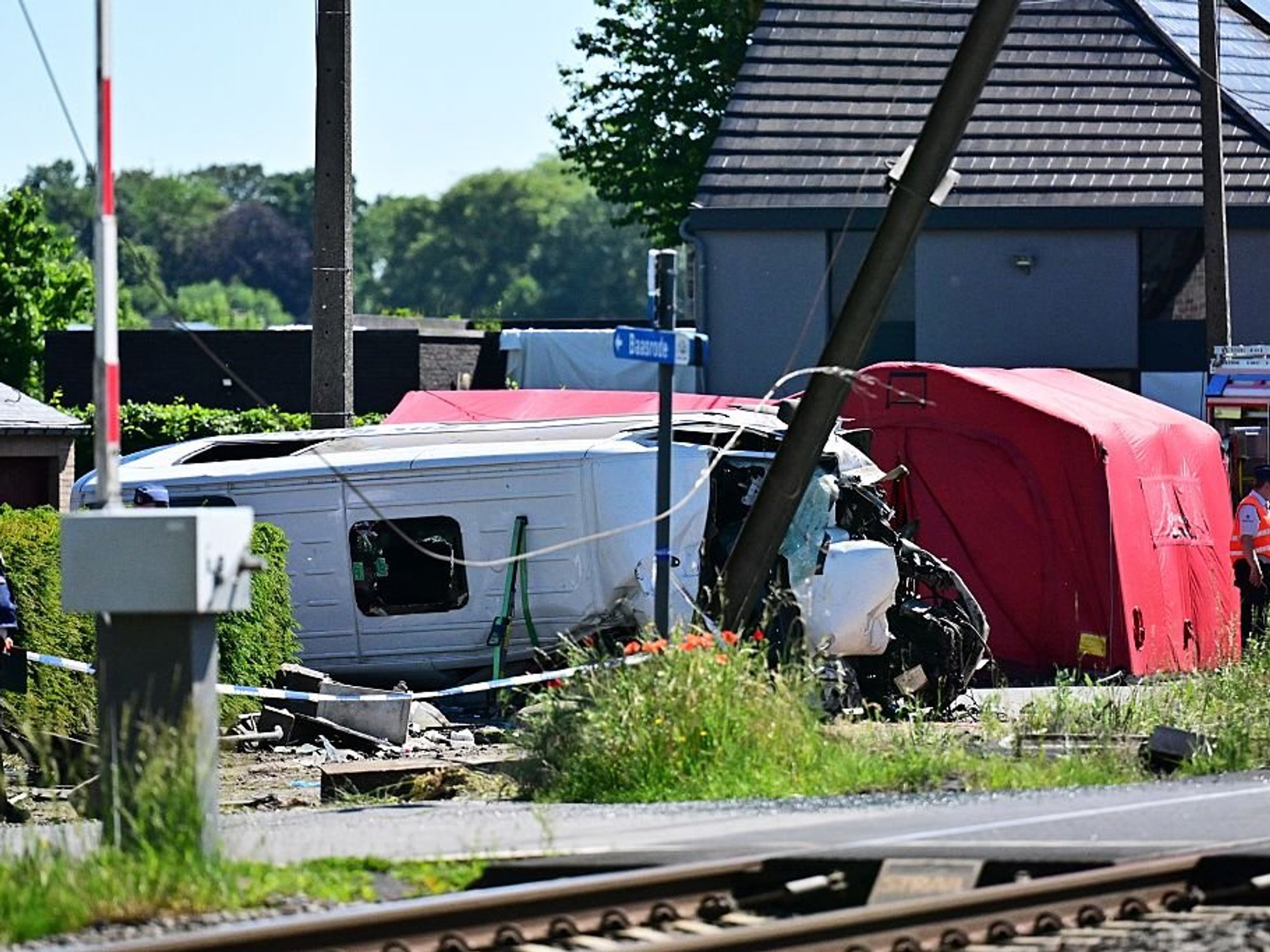 Multiple fatalities after school bus struck by passenger train in Belgium