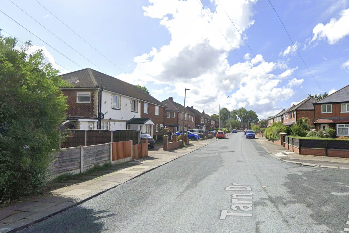 Officers remain at the scene in Tarn Drive, Bury