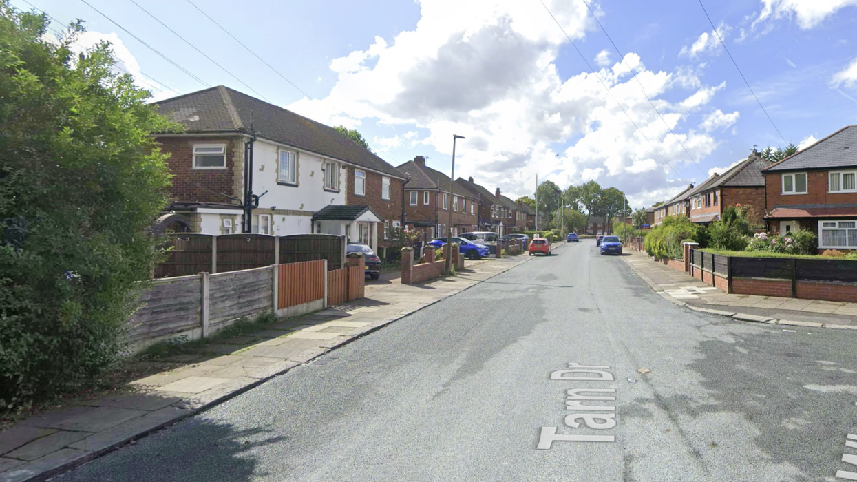 Officers remain at the scene in Tarn Drive, Bury