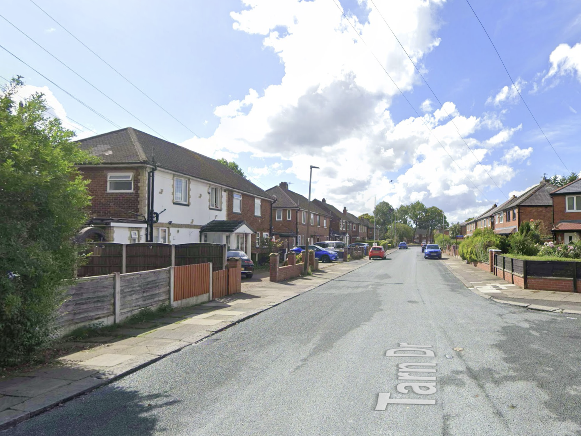 Officers remain at the scene in Tarn Drive, Bury