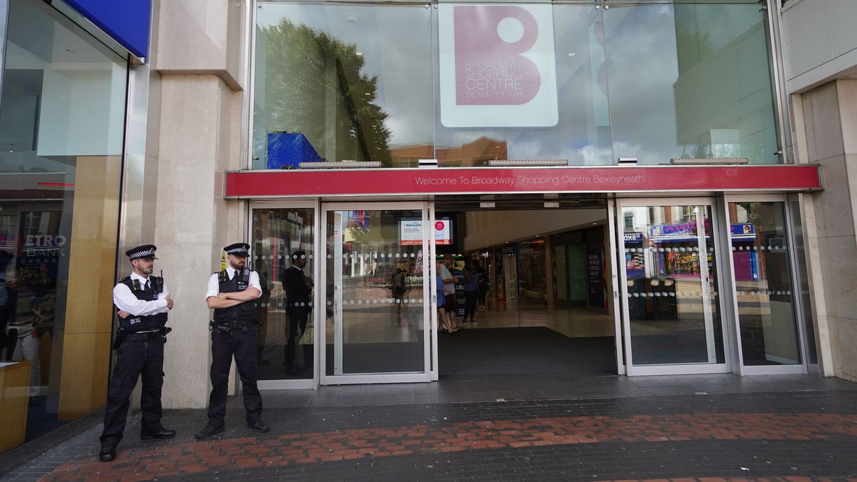 Officers standing outside a shopping centre