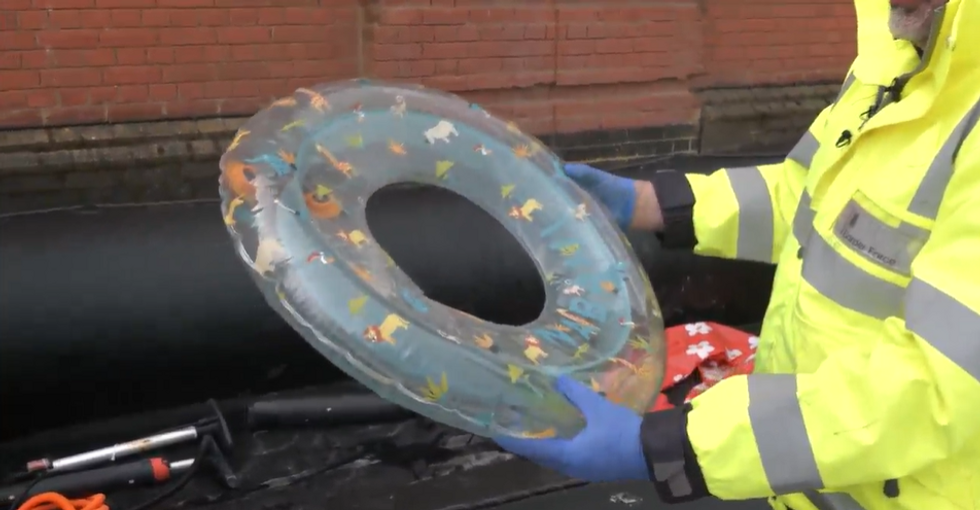 Official holding an inflatable plastic ring