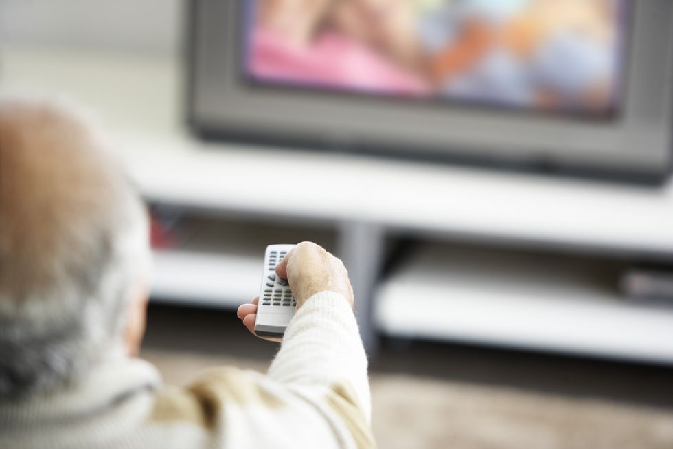 Old man watching TV