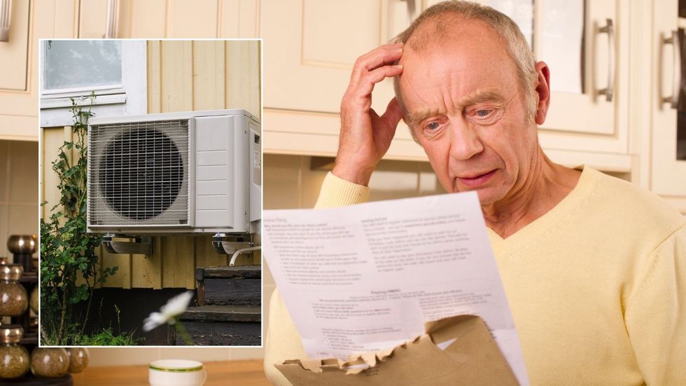 Older man looking at bill and heat pump