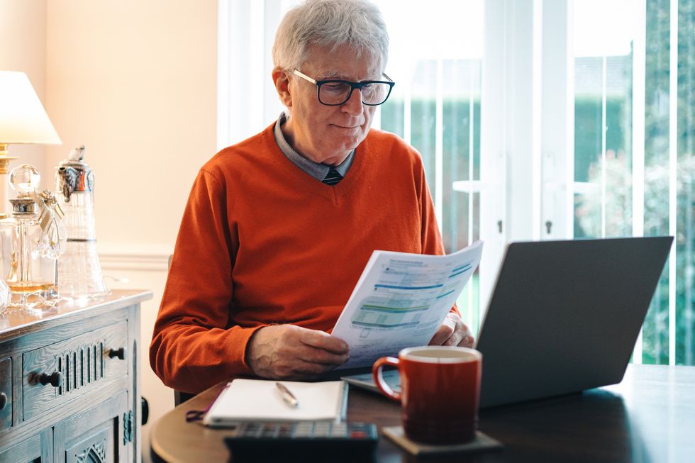 Older man looking at energy bill