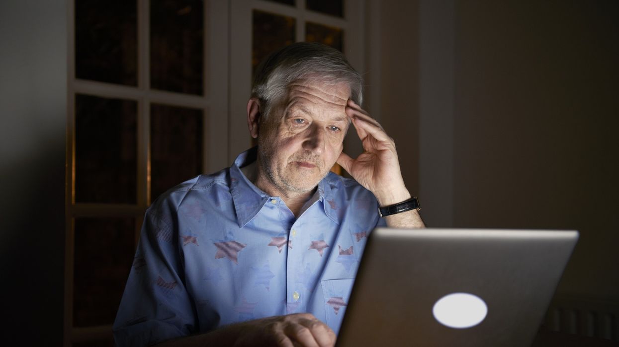 Older man looking at laptop
