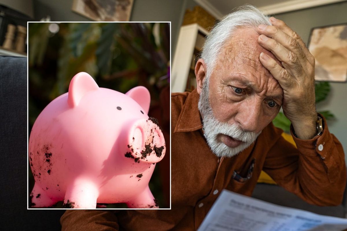 Older man looking at letter and piggy bank