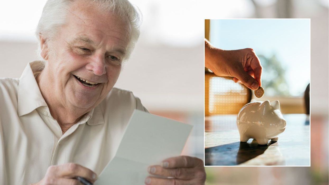 Older man looking at letter and piggy bank
