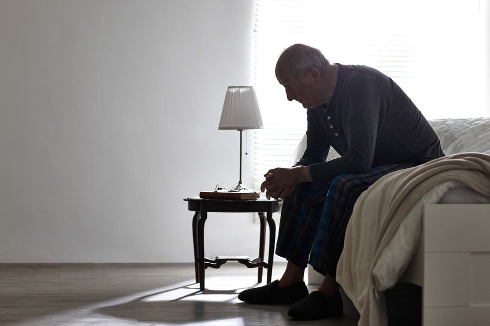 Older man looking sad