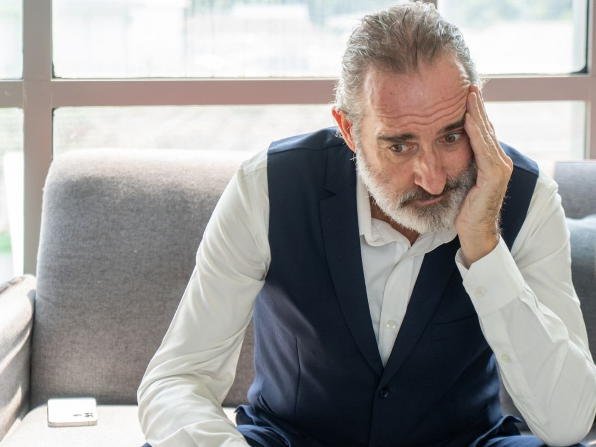Older man looking worried