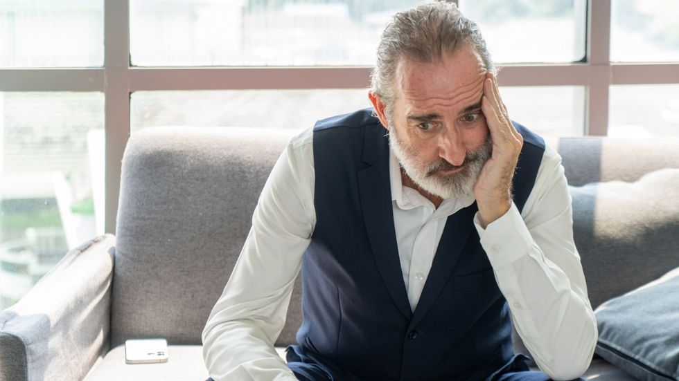 Older man looking worried