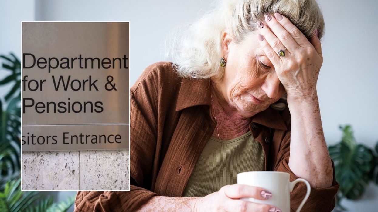 Older woman and DWP sign