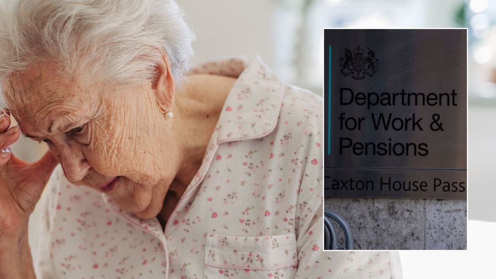 Older woman and DWP sign