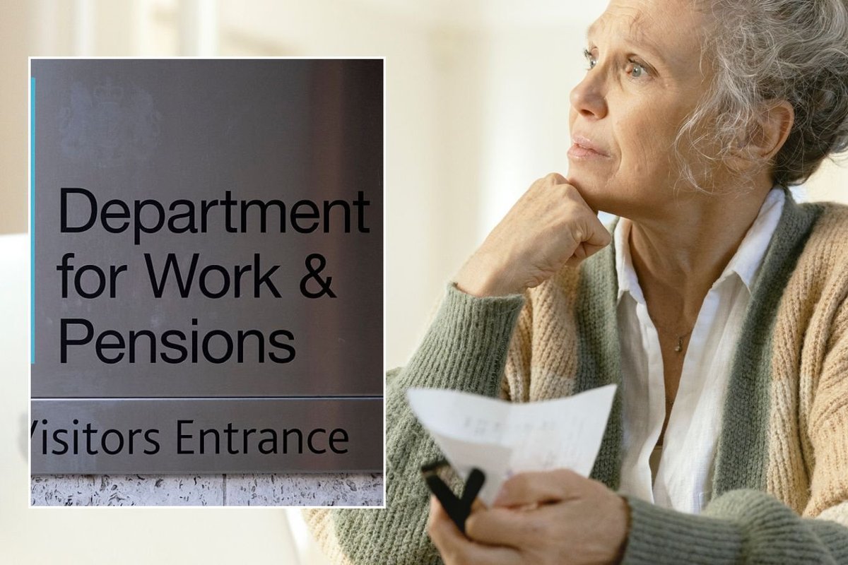 Older woman and DWP sign