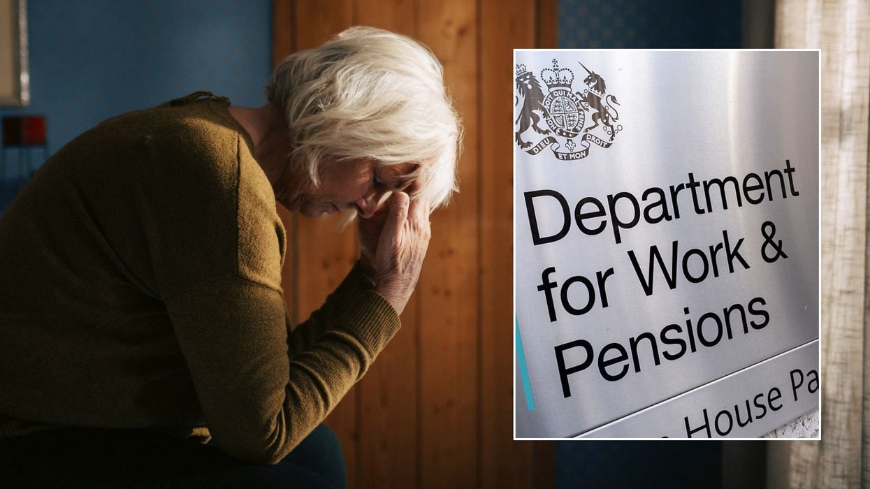 Older woman and DWP sign