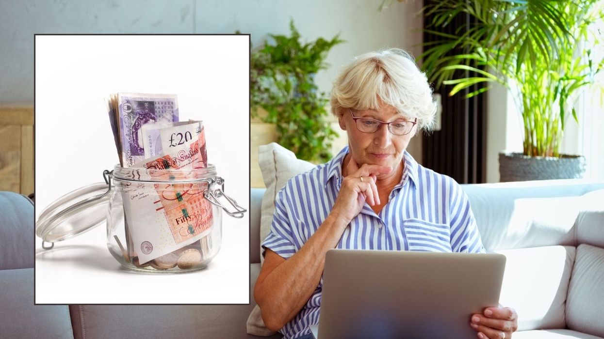 Older woman looking at laptop and pounds