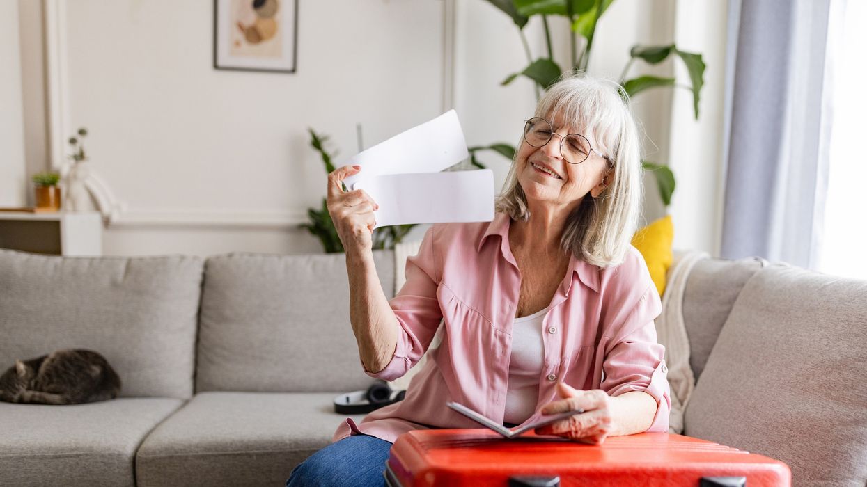 Older woman looking at letter