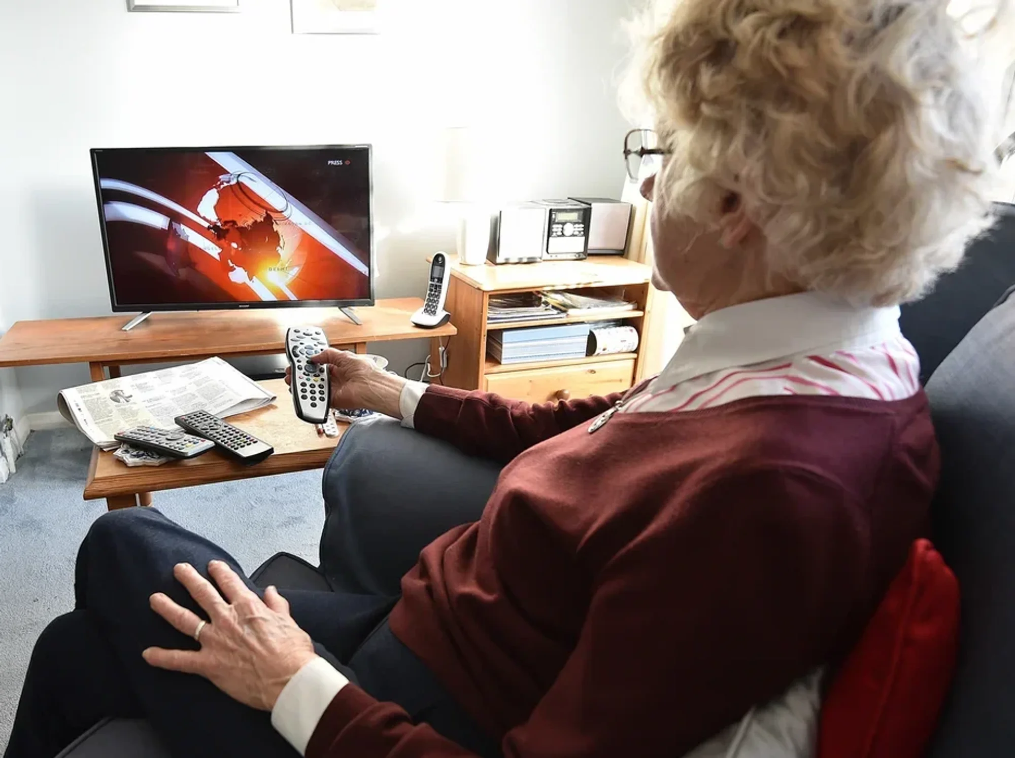 Older woman watching tv