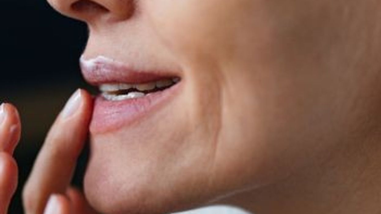 Older woman / Woman applying cream above lips