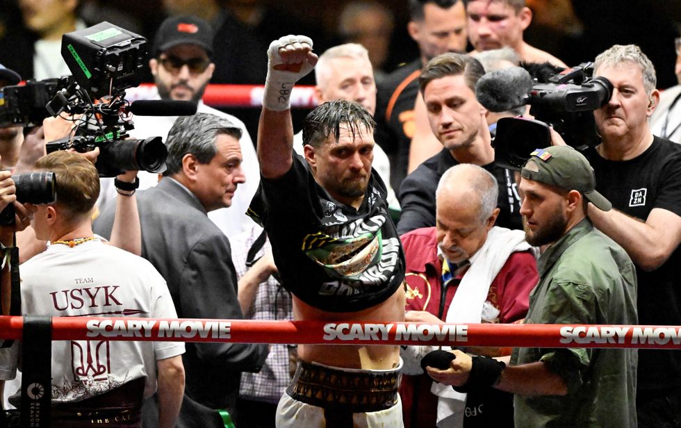 Oleksandr Usyk celebrates his victory on Saturday night