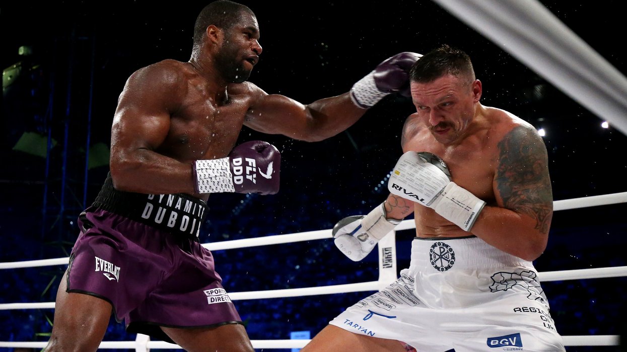 Oleksandr Usyk is punched by Daniel Dubois during the Heavyweight fight between Oleksandr Usyk and Daniel Dubois