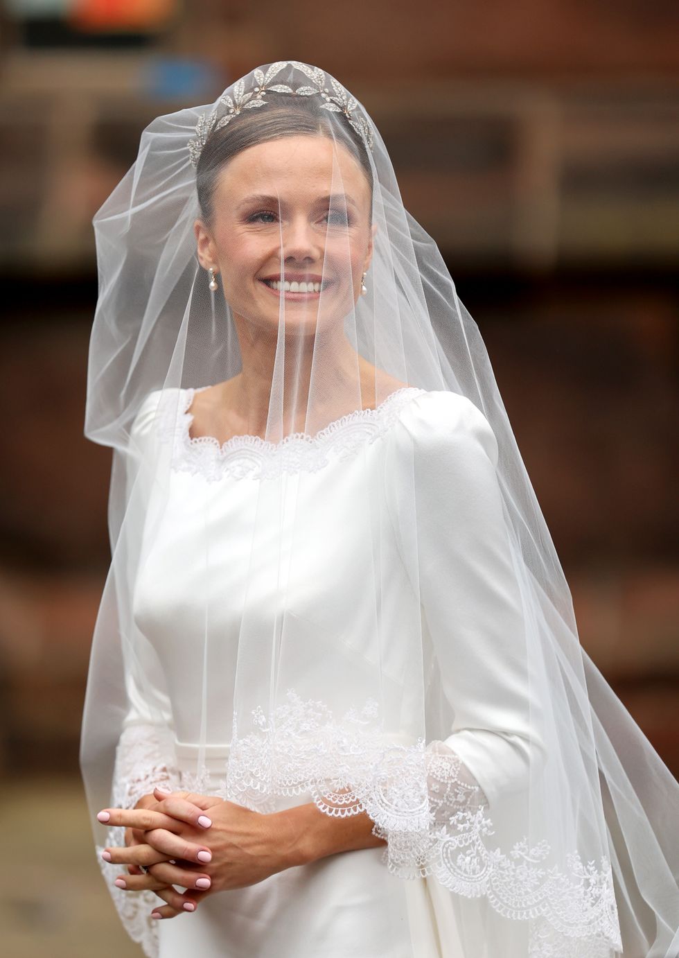 Olivia Henson in wedding dress at Chester Catherdral