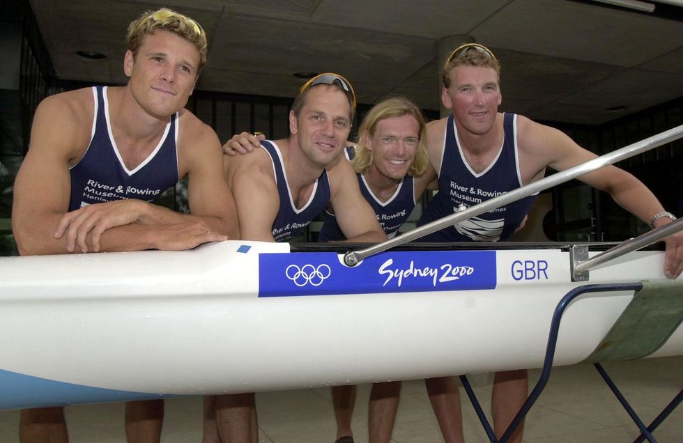 Olympic heroes James Cracknell, Sir Steven Redgrave, Tim Foster and Matthew Pinsent with their winning boat after rowing it for the last time on the River Thames in Henley, Oxfordshire