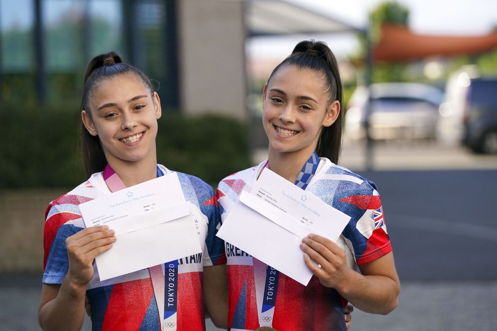 Olympic medal winning twins Jessica (left) and Jennifer Gadirova celebrate their GCSE results at Aylesbury Vale Academy in Buckinghamshire. Picture date: Thursday August 12, 2021.
