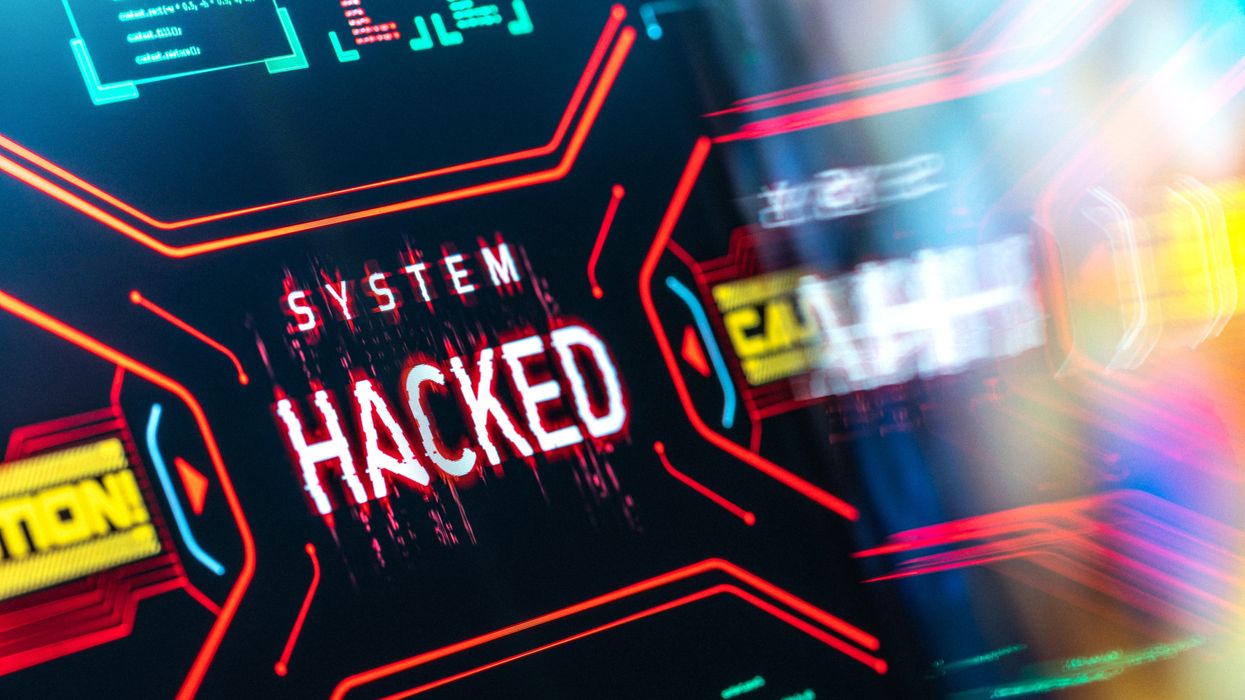 on-screen warning that says "system hacked" with colourful lines reflections