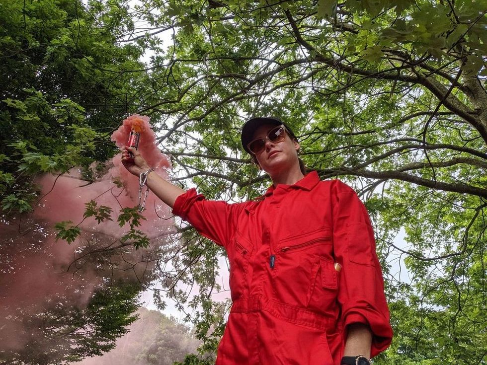 One of the protesters igniting a flare at the Bristol site\u200b