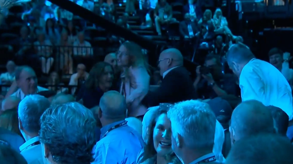 One of the protestors being carried out by security\u200b