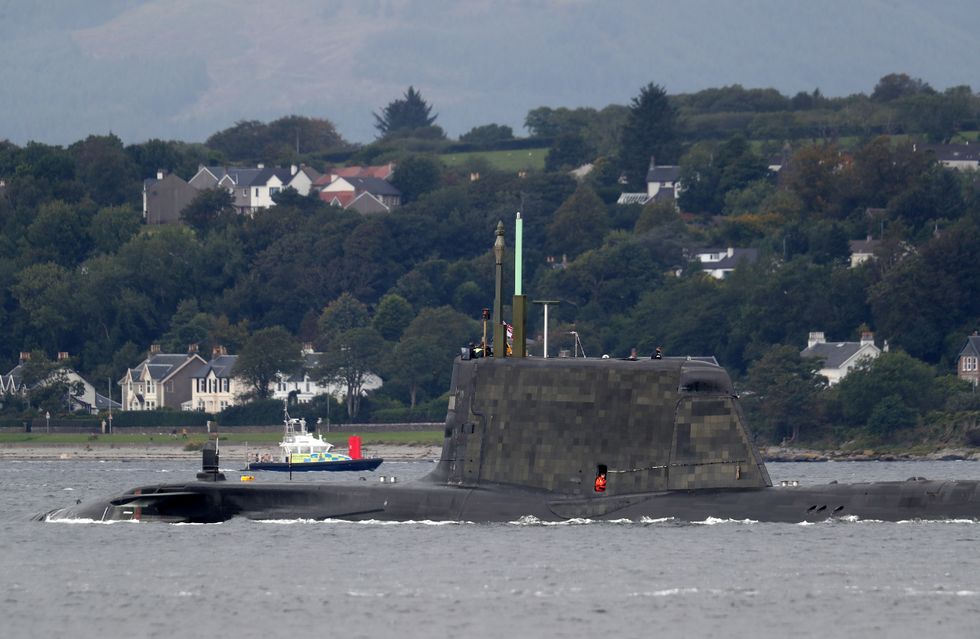 One of the Royal Navy's seven Astute-class nuclear-powered attack submarine moves through the water at the entrance to Holy Loch and Loch Long near Kilcreggan, in Argyll and Bute.