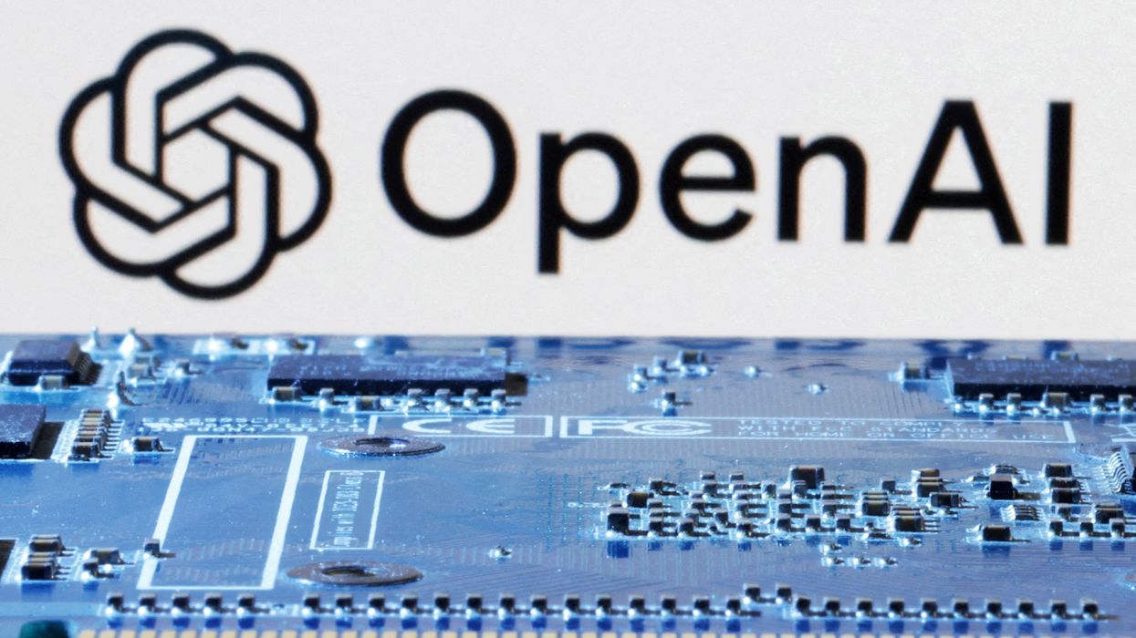 openAI company logo pictured behind a blue circuitboard