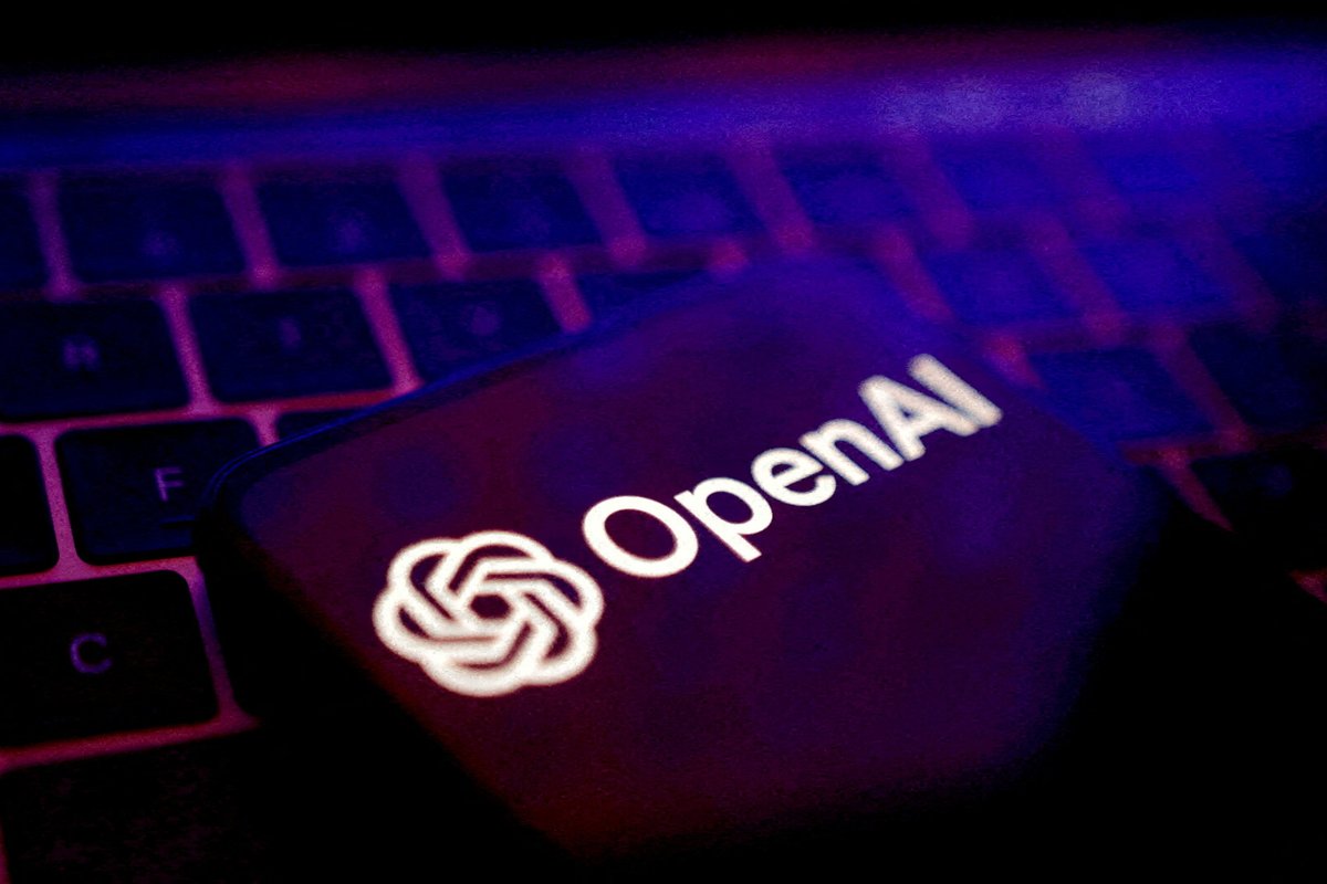 openAI logo pictured on a smartphone resting on a keyboard