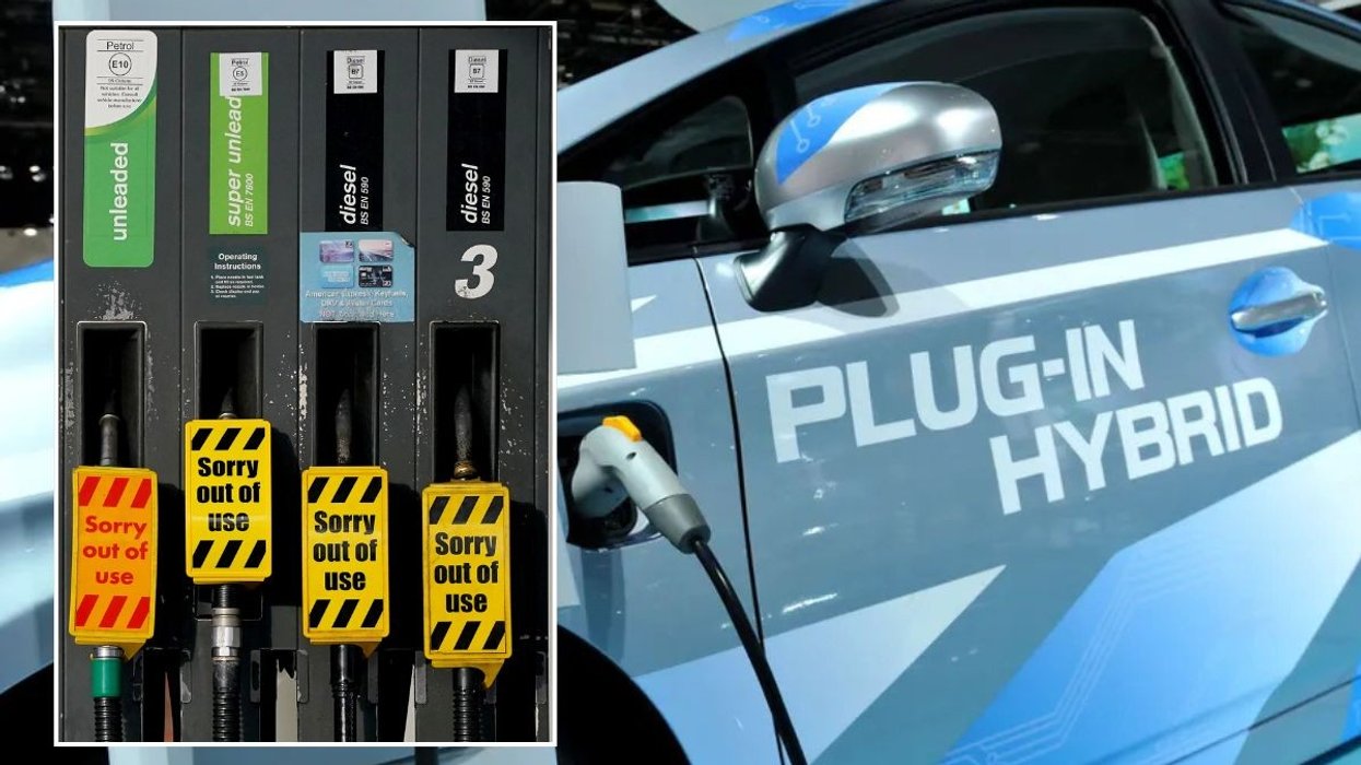 Out of use petrol and diesel pumps and a plug-in hybrid vehicle being charged