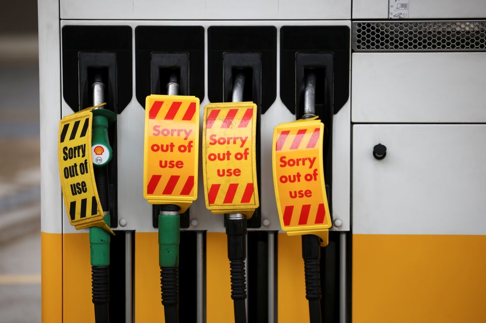 Out of use petrol and diesel pumps are pictured at a Shell fuel station in London
